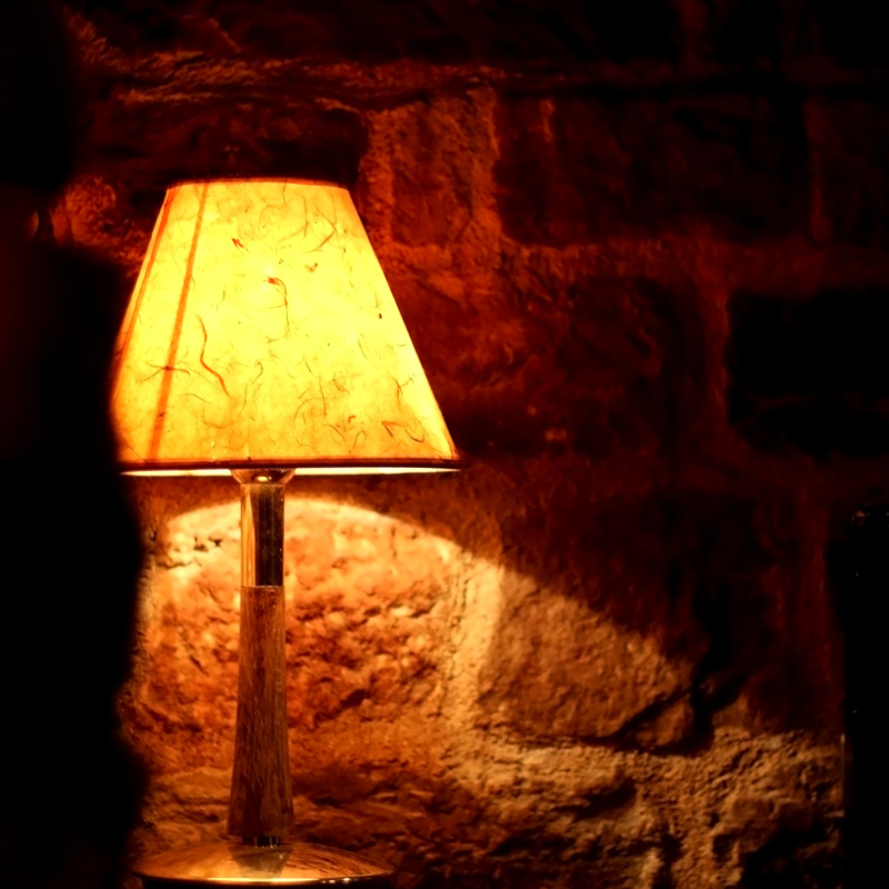 Vintage lamp lit at night. Selective focus.