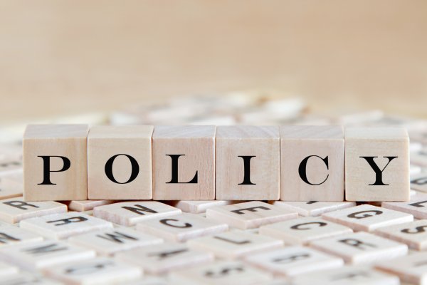 Image of wooden building blocks spelling out 'Policy'